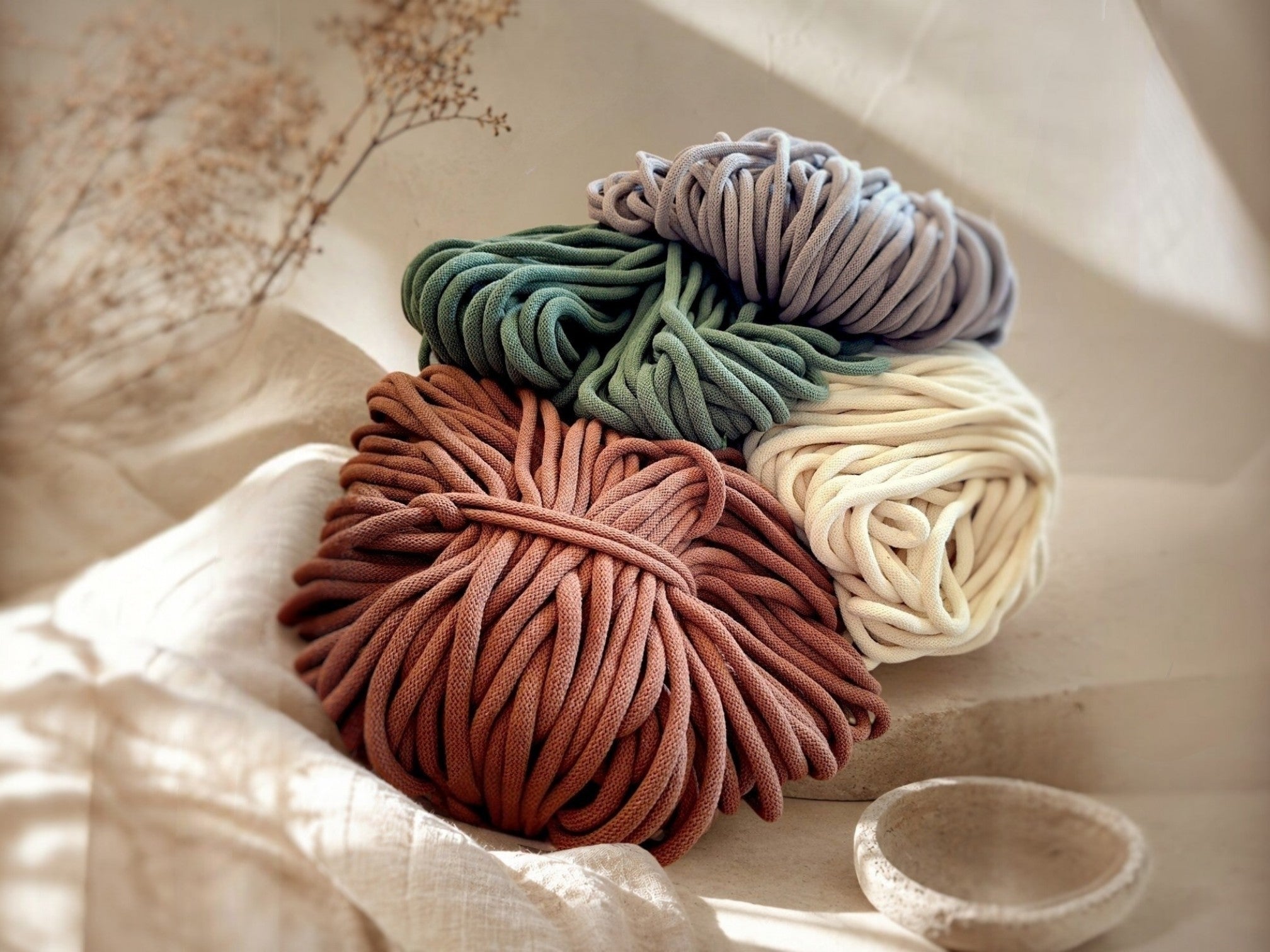 four colors of braiding cords arranged in a stack — kalarthe mat strap materials