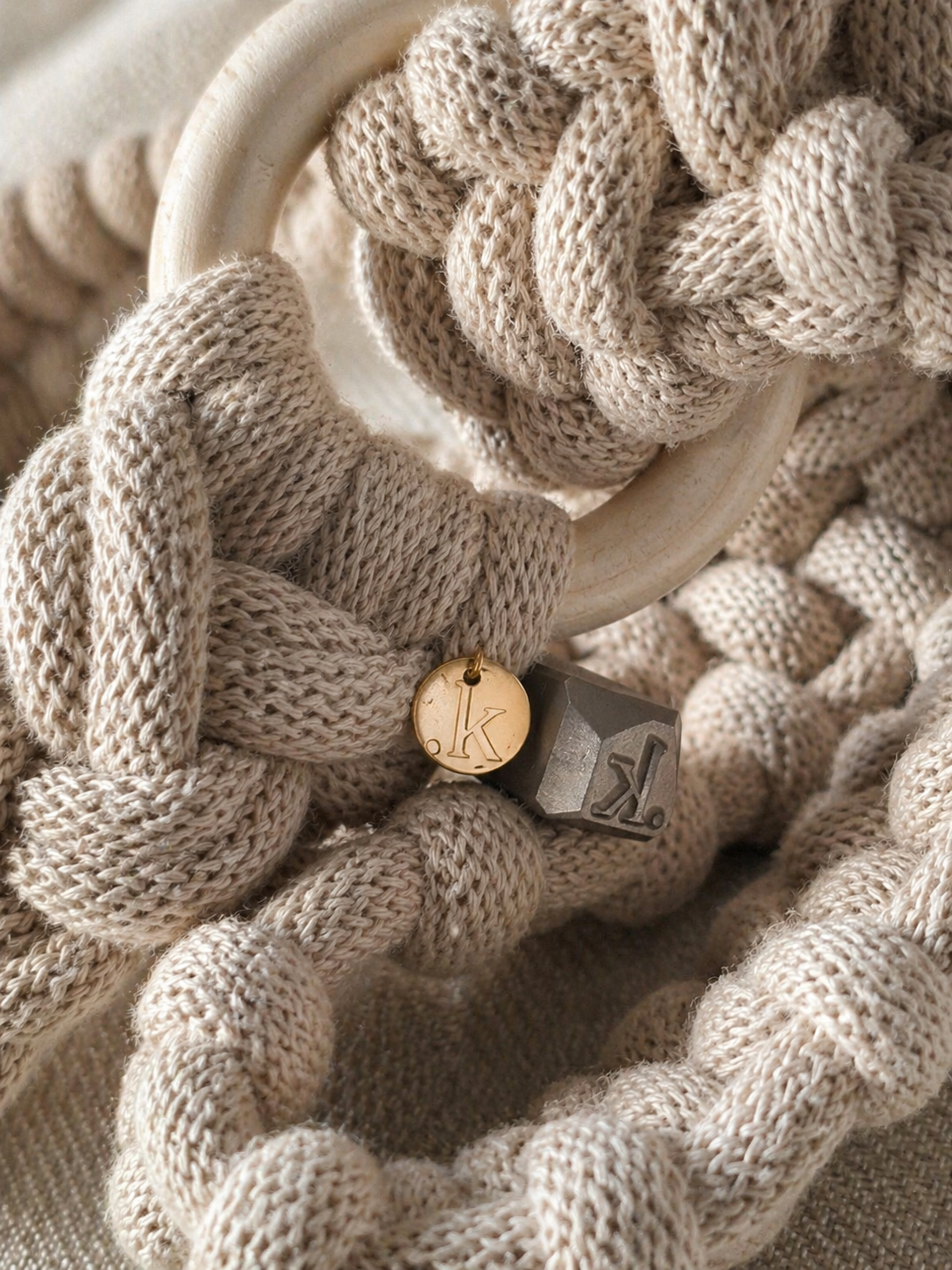 close-up of kalarthe copper tag with the letter k