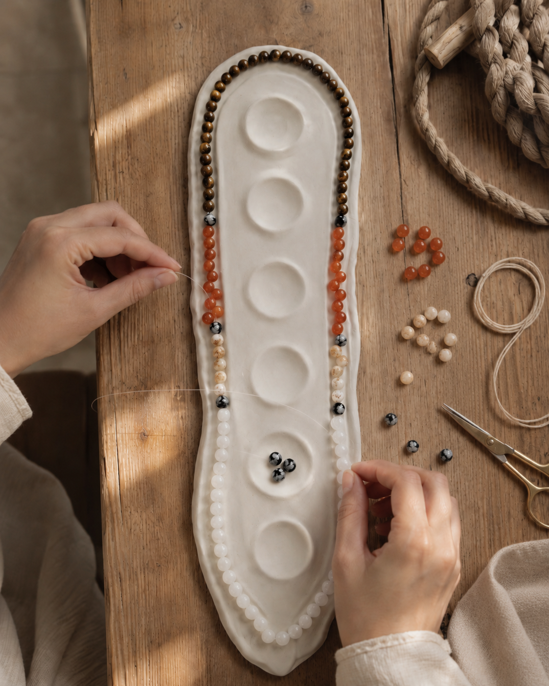 gemstones on the mala bord, making mala