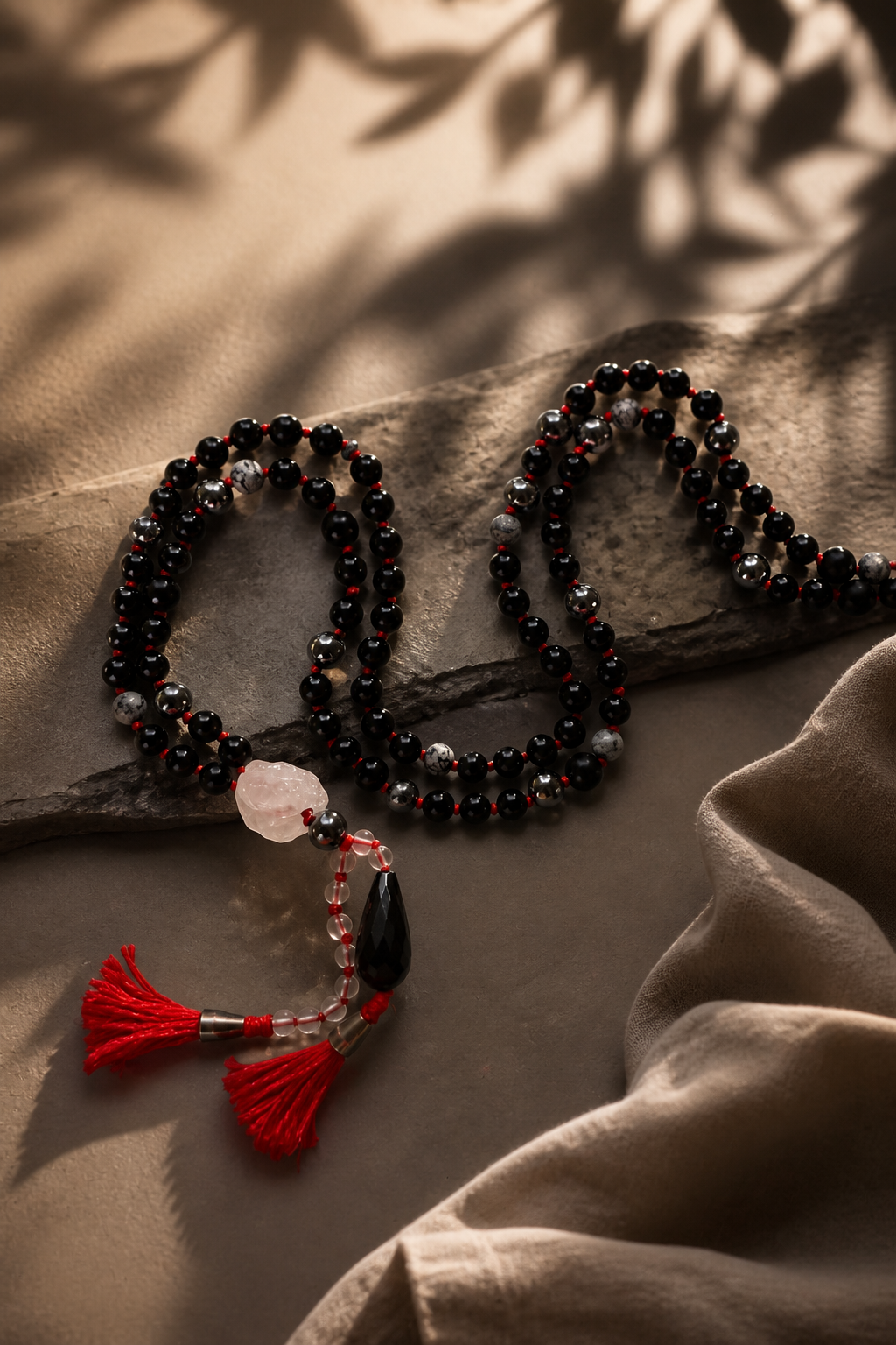 nocturne mala – handmade dark gemstone mala with red thread and raw clear quartz guru bead
