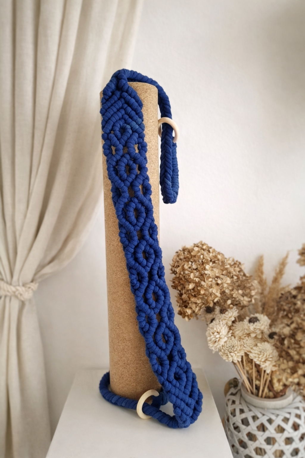 dhara. yoga mat strap — lifestyle shot with mat