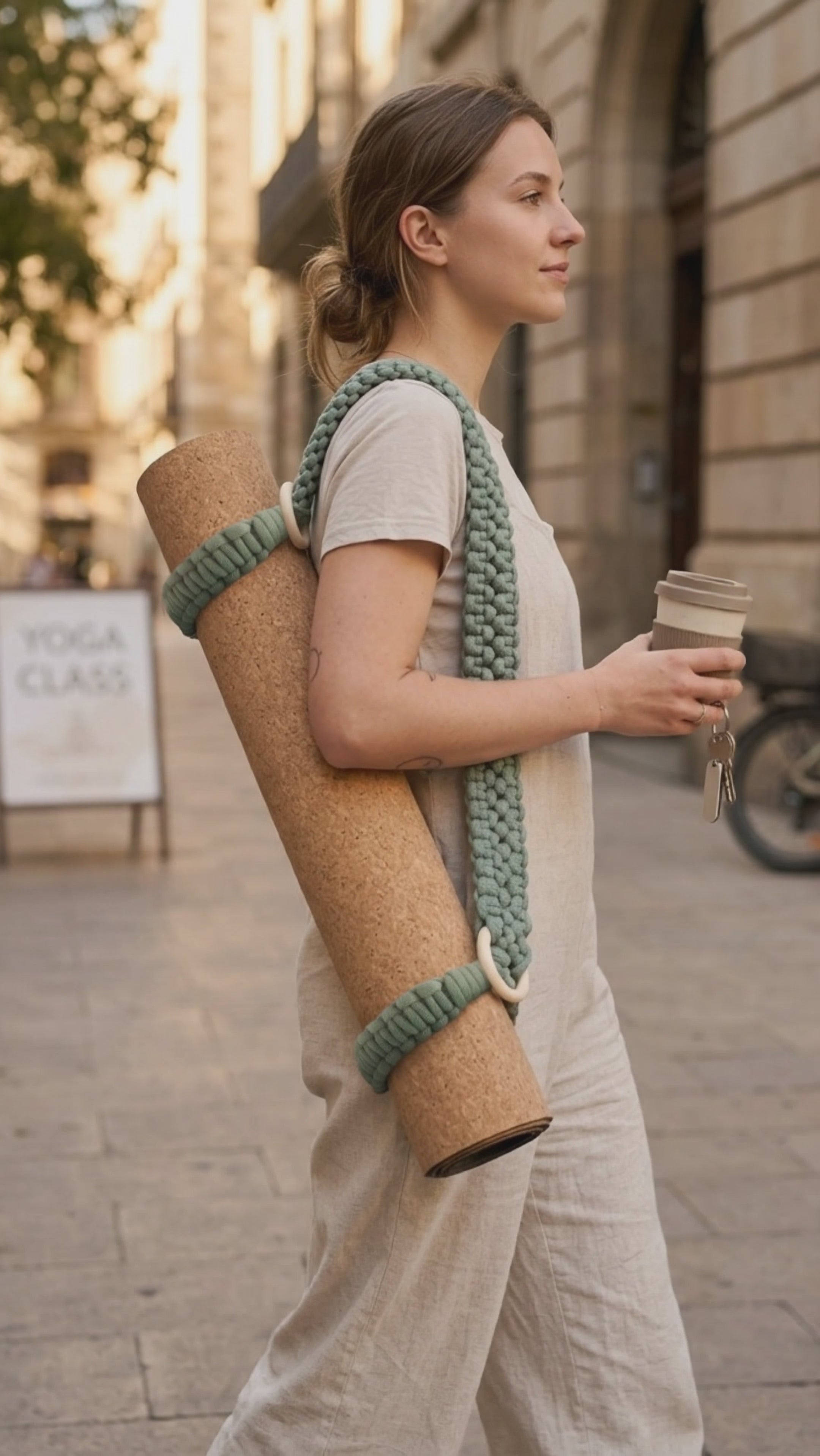 setu. handmade carrier strap with wooden rings, lifestyle movie, girl going slowly through the city 