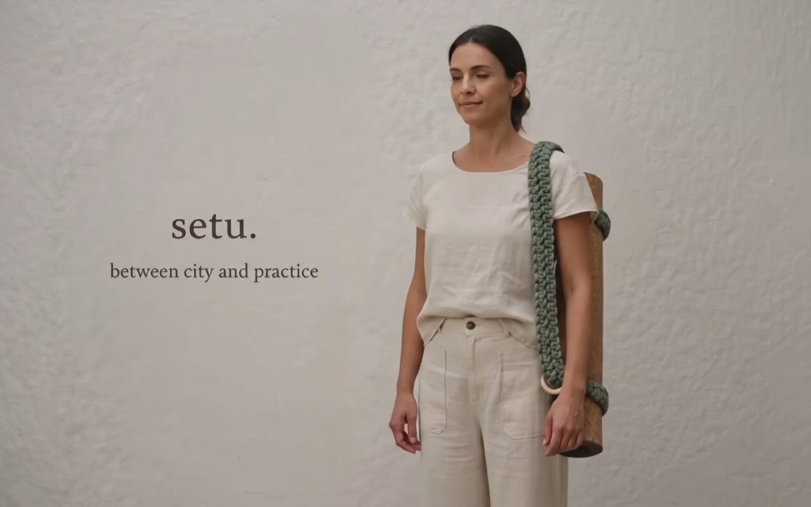 [video] woman walking through the scene with setu yoga mat strap — between city and practice