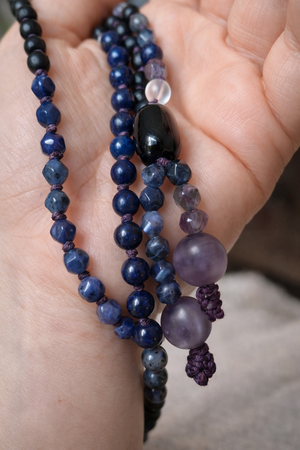 threshold mala — guru bead detail, polished onyx with hand-knotted cord